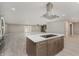 Open-concept kitchen with stainless steel appliances and a large island at 4477 Devon Lake Rd, Indianapolis, IN 46226