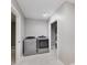 Bright laundry room with modern, front-load washer and dryer at 4477 Devon Lake Rd, Indianapolis, IN 46226