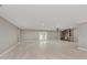 Bright, open living room with wood-look floors and fireplace at 4477 Devon Lake Rd, Indianapolis, IN 46226