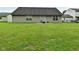 An expansive backyard with green grass and a concrete patio at 4528 Hunt Master Ct, Indianapolis, IN 46268