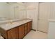 A bathroom that features a double sink vanity and gold fixtures at 4528 Hunt Master Ct, Indianapolis, IN 46268
