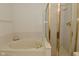 A bathroom featuring a bathtub and shower area with gold trimming at 4528 Hunt Master Ct, Indianapolis, IN 46268