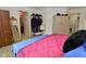 This cozy bedroom features a wardrobe, closet rack and a view into the bathroom at 4528 Hunt Master Ct, Indianapolis, IN 46268