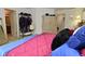 A bedroom featuring a rack filled with clothes and a storage dresser at 4528 Hunt Master Ct, Indianapolis, IN 46268