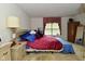 The bedroom with a queen sized bed features classic decor and natural light at 4528 Hunt Master Ct, Indianapolis, IN 46268