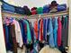 A closet brimming with a vibrant array of clothes and accessories at 4528 Hunt Master Ct, Indianapolis, IN 46268