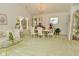 Well-lit dining room with a chandelier, display cabinet, and seating for six; perfect for entertaining at 4528 Hunt Master Ct, Indianapolis, IN 46268
