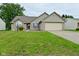 Charming single-Gathering home with a well-manicured lawn and an attached two-car garage at 4528 Hunt Master Ct, Indianapolis, IN 46268