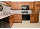 Traditional kitchen features wood cabinets and laminate countertops at 4528 Hunt Master Ct, Indianapolis, IN 46268