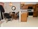 Kitchen area with table and chairs, wood cabinets, and black appliances at 4528 Hunt Master Ct, Indianapolis, IN 46268