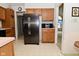 Kitchen features stainless steel refrigerator and wooden cabinets at 4528 Hunt Master Ct, Indianapolis, IN 46268