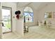 Bright living room featuring a large window, vaulted ceiling, and comfortable seating arrangement at 4528 Hunt Master Ct, Indianapolis, IN 46268