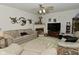 Spacious living room with neutral walls, carpet, fireplace, and sofas at 4528 Hunt Master Ct, Indianapolis, IN 46268