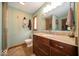 Well-lit bathroom with a granite vanity, modern fixtures, and a walk-in shower behind a glass door at 506 Deerberry Dr, Noblesville, IN 46062