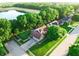 Stunning aerial view of the house nestled in a lush neighborhood with a nearby lake at 5073 St Charles Pl, Carmel, IN 46033