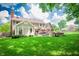 Expansive backyard showcasing a well-maintained lawn, patio area, and the home's exterior at 5073 St Charles Pl, Carmel, IN 46033
