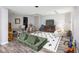 Basement with a gray plank flooring, soft sofa and chairs, and various toys and games at 5073 St Charles Pl, Carmel, IN 46033