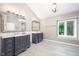 Spacious bathroom with dual vanities, recessed lighting, and tiled floors at 5073 St Charles Pl, Carmel, IN 46033