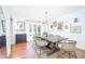Elegant dining room featuring a large wooden table, stylish chairs, and ample natural light at 5073 St Charles Pl, Carmel, IN 46033