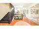 Inviting foyer features a staircase, hardwood floors, and a view into the living room at 5073 St Charles Pl, Carmel, IN 46033