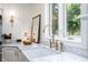 Bright kitchen featuring marble countertops, brass faucet, and farmhouse sink at 5073 St Charles Pl, Carmel, IN 46033