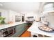 Open kitchen with large island, stainless steel appliances, and ample counter space at 5073 St Charles Pl, Carmel, IN 46033