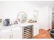 Kitchen with marble countertop, wine fridge, white cabinets, and wood floors at 5073 St Charles Pl, Carmel, IN 46033