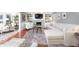 Bright living room featuring white couches, a fireplace, built-in shelves, and hardwood floors at 5073 St Charles Pl, Carmel, IN 46033