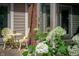 Cozy outdoor patio featuring comfortable seating, blooming hydrangeas, and brick accents at 5073 St Charles Pl, Carmel, IN 46033