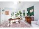 Sunny sunroom featuring brick floors, white walls, and a large fiddle leaf fig at 5073 St Charles Pl, Carmel, IN 46033