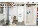 Functional basement bathroom featuring a toilet, sink, and shower stall at 518 N Emerson Ave, Indianapolis, IN 46219
