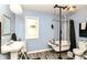 Bright bathroom features a classic clawfoot tub, pedestal sink, and modern fixtures at 518 N Emerson Ave, Indianapolis, IN 46219