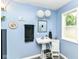 Stylish blue bathroom with a vessel sink, modern lighting, and a clean, minimalist design at 518 N Emerson Ave, Indianapolis, IN 46219
