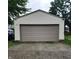 Exterior view of a detached two-car garage with gravel driveway at 518 N Emerson Ave, Indianapolis, IN 46219