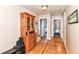 Hallway with wood floors and built-in storage, seamlessly connecting various rooms within the home at 518 N Emerson Ave, Indianapolis, IN 46219