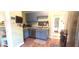Charming kitchen features stainless steel appliances, blue cabinets, and hardwood floors at 518 N Emerson Ave, Indianapolis, IN 46219