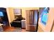 Cozy kitchen featuring stainless steel refrigerator, cabinets, and hardwood floors at 518 N Emerson Ave, Indianapolis, IN 46219