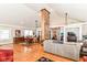 Open concept living room with hardwood floors, fireplace, and plenty of natural light at 518 N Emerson Ave, Indianapolis, IN 46219