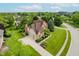 Aerial view showcasing the house and landscaping in a suburban neighborhood at 5251 Apache Moon, Carmel, IN 46033