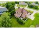 Aerial view of the house highlighting its mature trees and well-maintained lawn at 5251 Apache Moon, Carmel, IN 46033