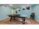 Finished basement with a recreational ping pong table at 5251 Apache Moon, Carmel, IN 46033