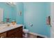 Powder room featuring blue walls and traditional vanity at 5251 Apache Moon, Carmel, IN 46033