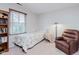 Bedroom with a chair, a small table and a window with wood blinds at 5251 Apache Moon, Carmel, IN 46033