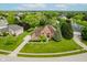 A well-maintained two-story brick home with a landscaped front yard and a long concrete driveway at 5251 Apache Moon, Carmel, IN 46033