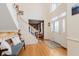 Inviting foyer with a staircase, bench seating, and a bright front door at 5251 Apache Moon, Carmel, IN 46033