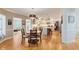 Open-concept kitchen with a center island, stainless steel appliances and adjacent dining area filled with natural light at 5251 Apache Moon, Carmel, IN 46033