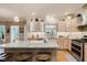 Well-lit kitchen featuring granite countertops, stainless steel appliances and light wood cabinetry at 5251 Apache Moon, Carmel, IN 46033