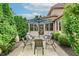 Covered patio with table and chairs and patio umbrella for outdoor relaxation at 5251 Apache Moon, Carmel, IN 46033