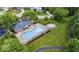 Aerial view shows a community pool and spa surrounded by lounge chairs and well-manicured landscaping at 5251 Apache Moon, Carmel, IN 46033