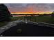 Picturesque dusk scene with a fire pit, pergola, and lake view at 5758 N 900 W, Thorntown, IN 46071